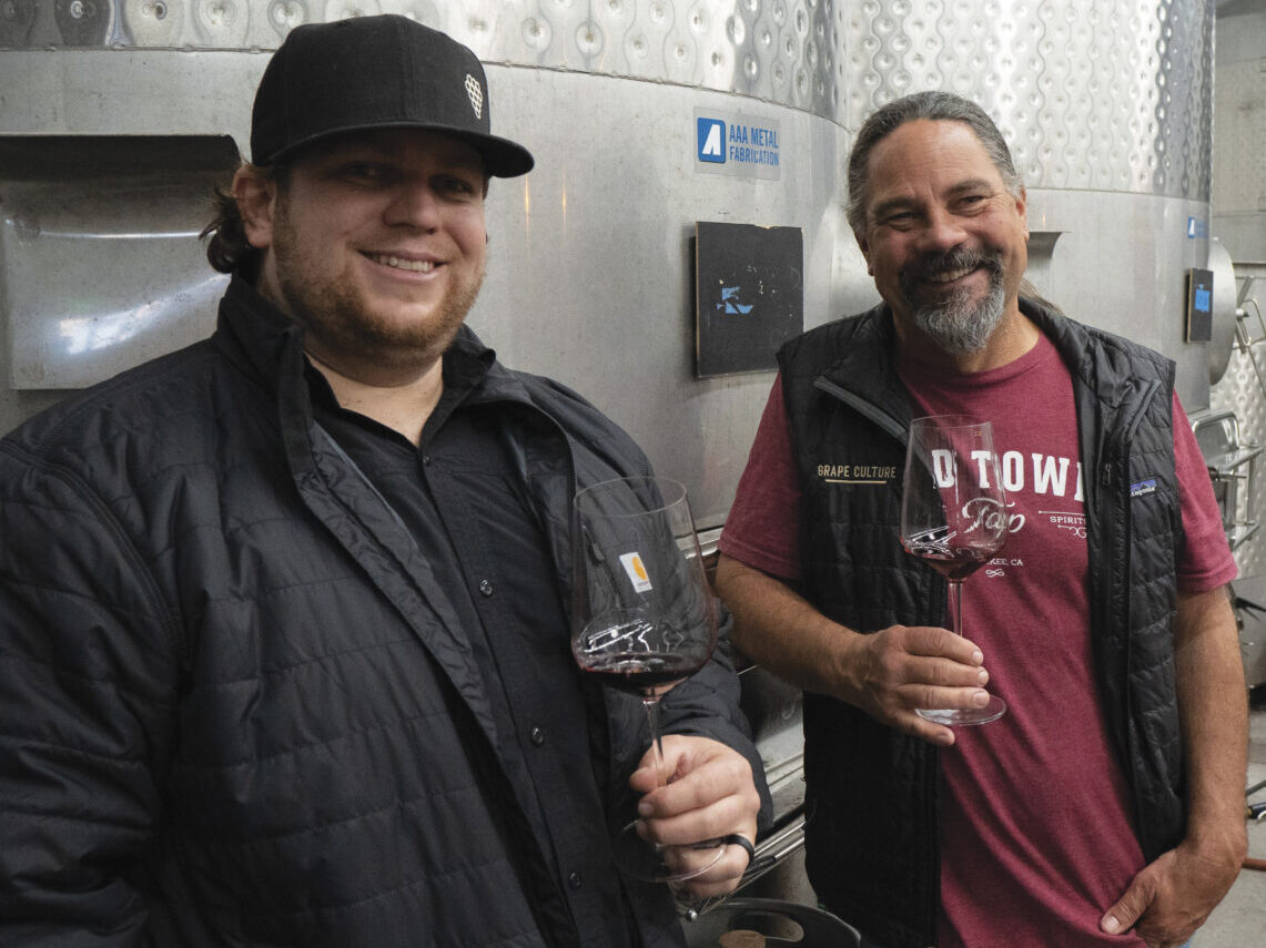 COLLIN CRANER WITH WINEMAKER, CRAIG PLOOF holding glasses of wine