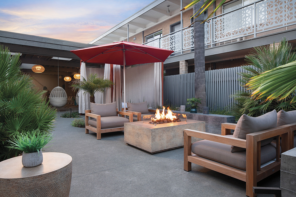 Exterior courtyard with fire pit and cabanas at Dr. Wilkinson's 