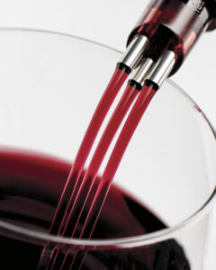 Tribella Aerator pouring red wine into a wine glass