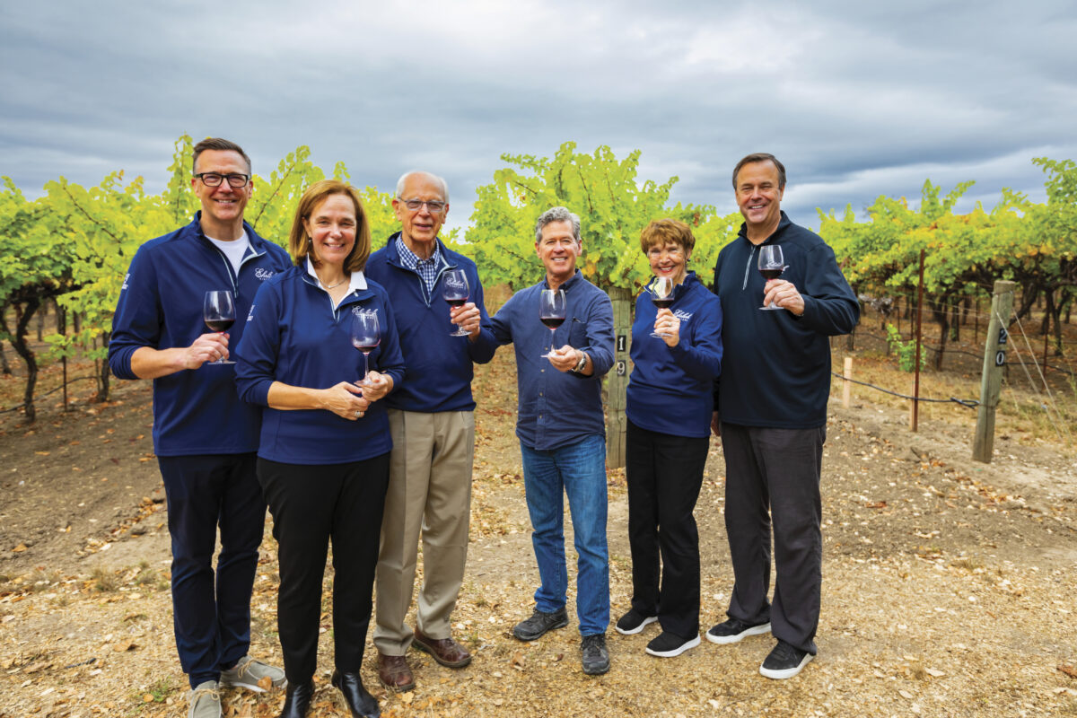 The Ehrlich Family stand in the vineyard with Paul Hobbs 