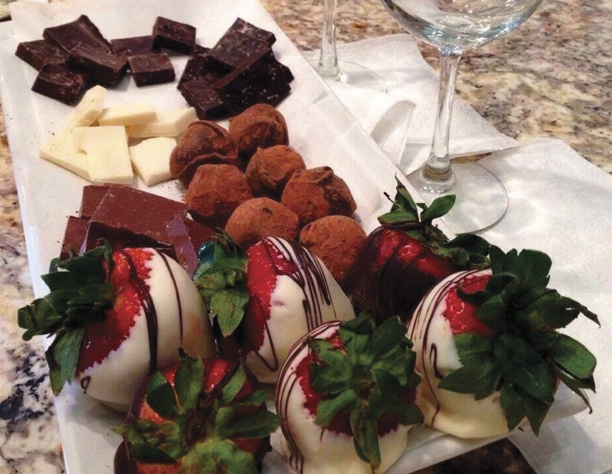 Assortment of chocolates and chocolate-dipped strawberries