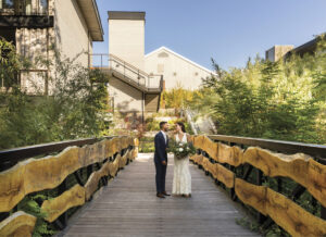 Bride and Groom in a wooden walkway at Alila Resort
