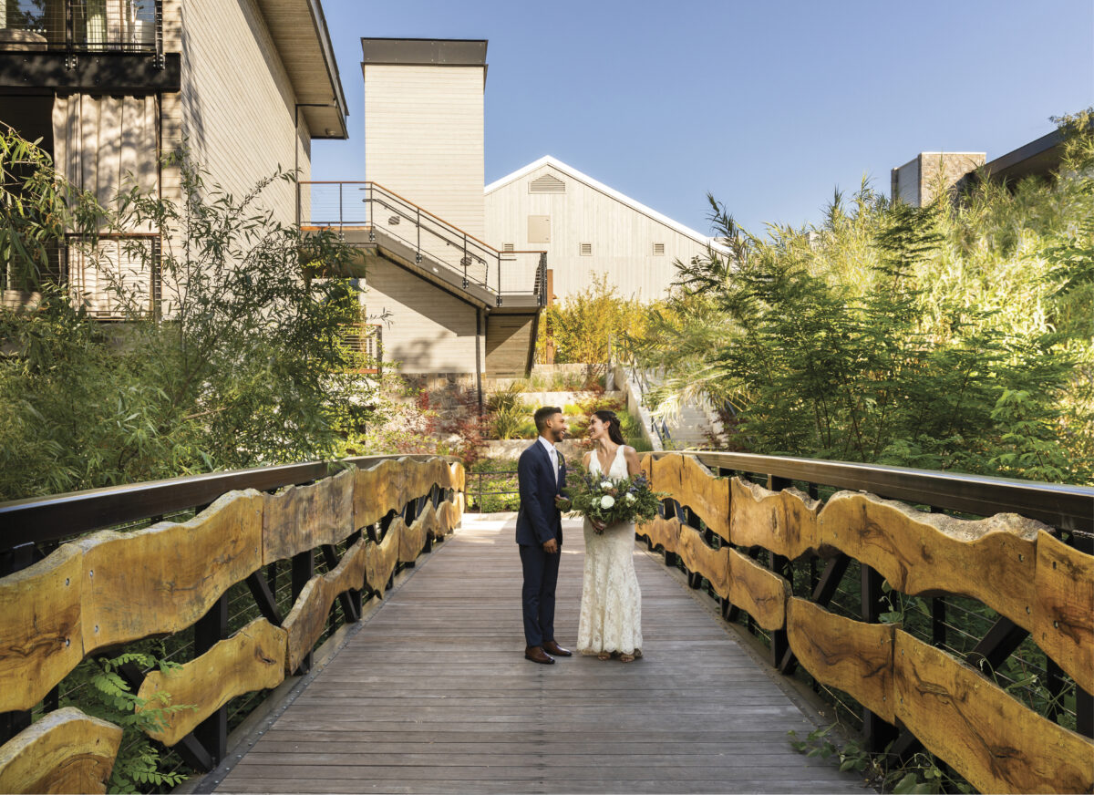 Bride and Groom in a wooden walkway at Alila Resort