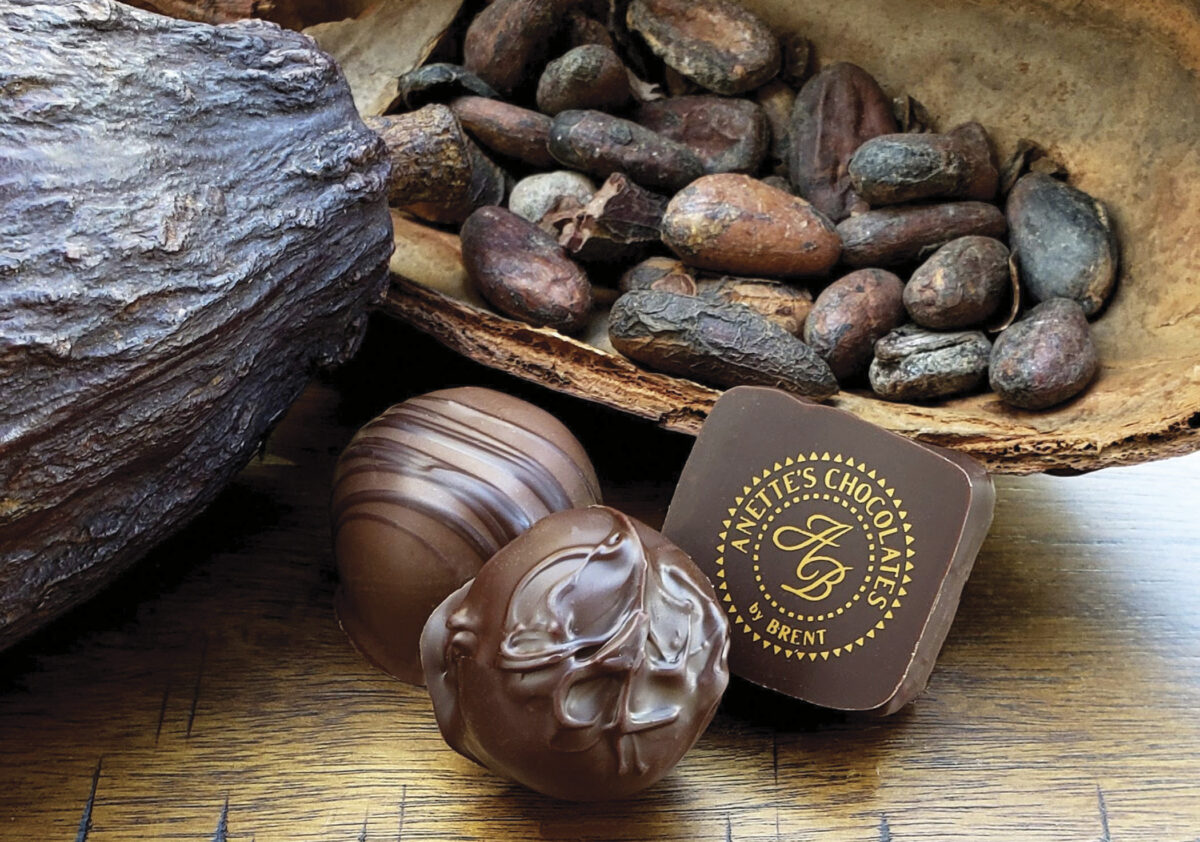 Selection of chocolates and nuts on a wooden table