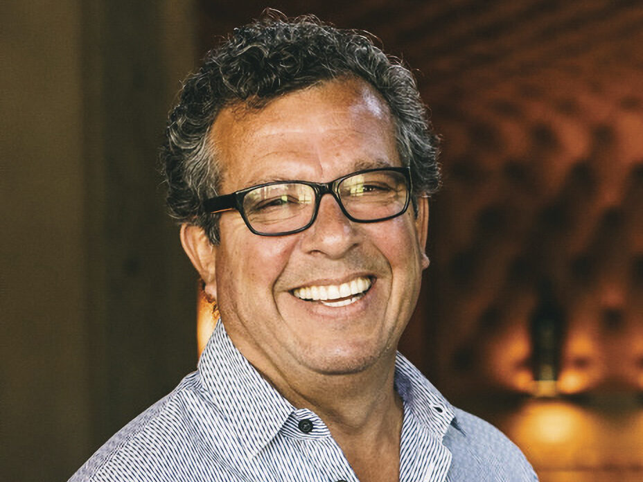 headshot of Robert Torres, wearing glasses, smiling