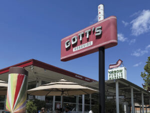 exterior view of Gott's Roadside restaurant and red sign in Napa with blue sky