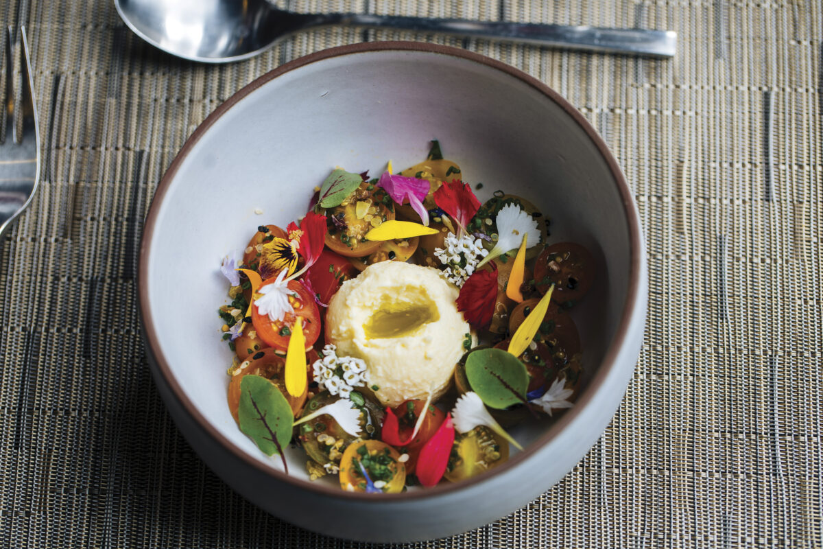 bowl of colorful salad on wood table