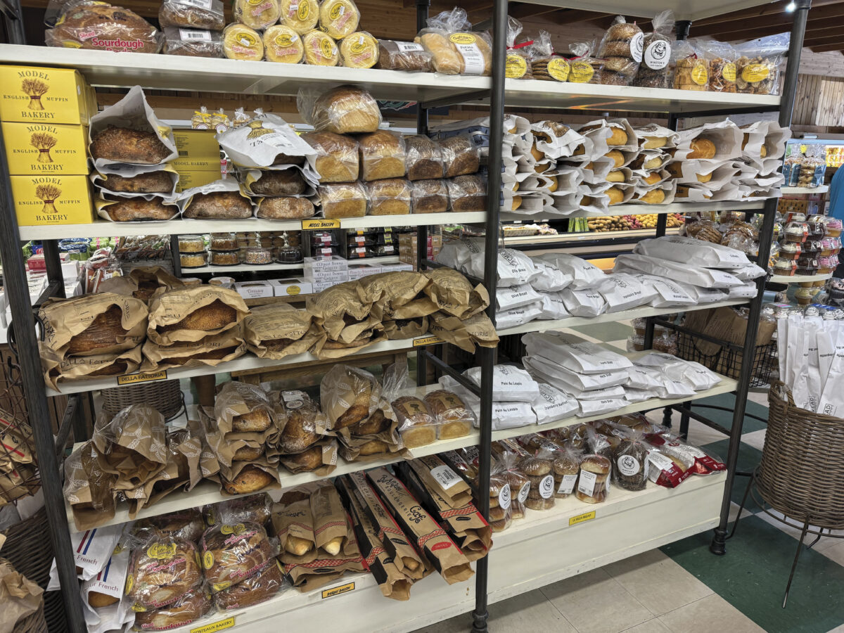 Rows of baked goods for sale in a market