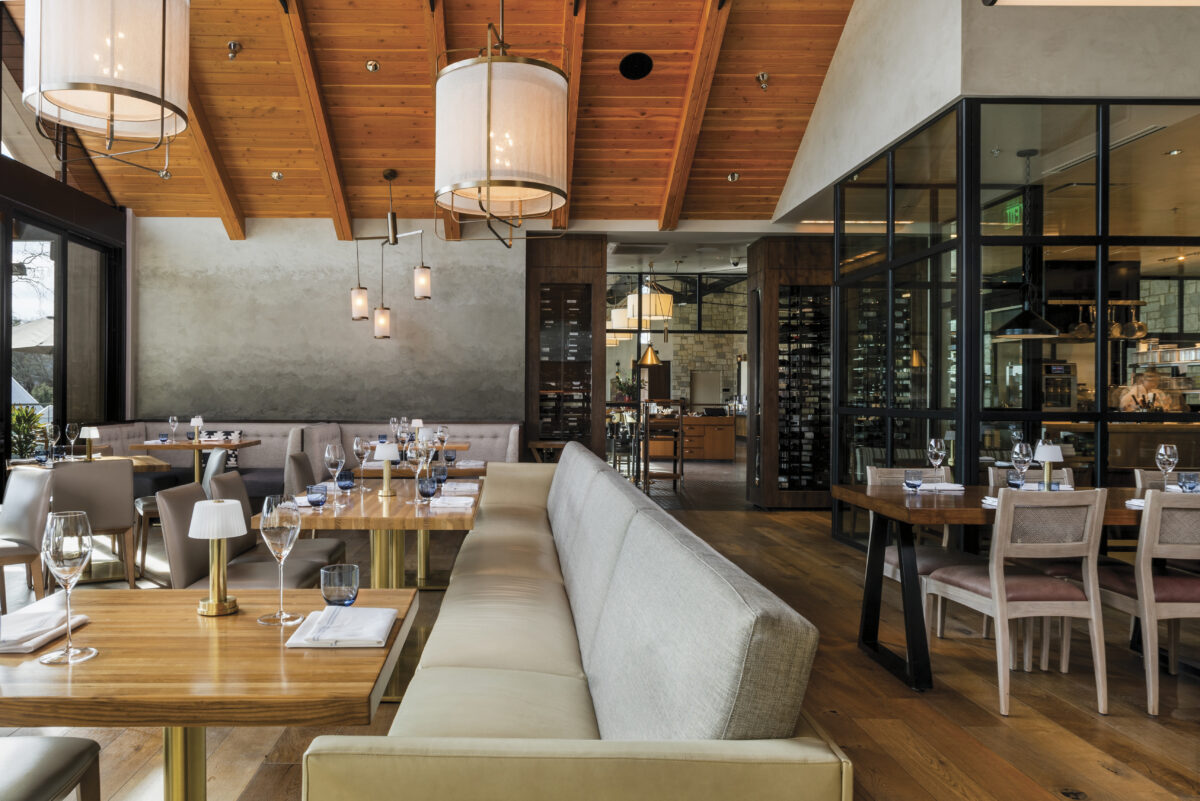 Interior dining room Auro at Four Seasons Resort and Residences Napa Valley with wood tables and ceilings