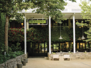 St. Supery Winery Entrance with greenery signage, and seating in front. Photo Credit Meg SmithA