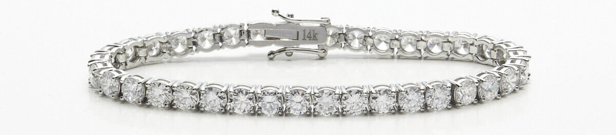 diamond tennis bracelet on white table For the article Holiday Gift Guide