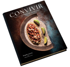 Convivir book book cover with plate of food displayed on cover for article Holiday Gift Guide