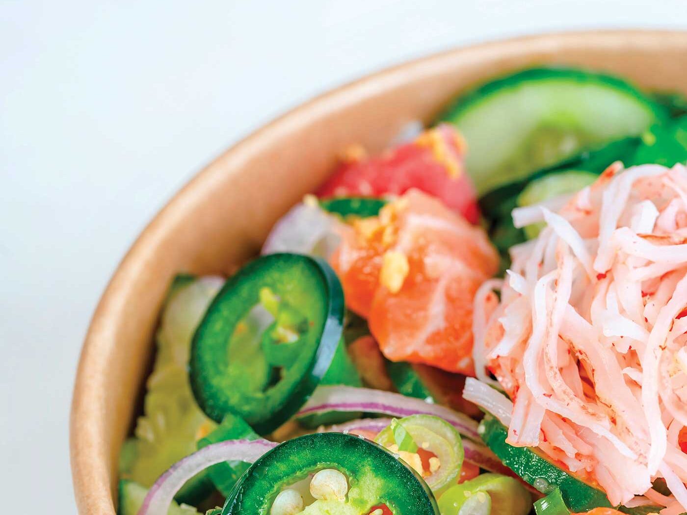 bowl of poke with brightly colored jalapenos and kimchi for American Canyon article