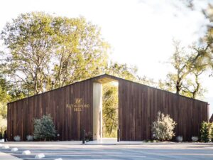 wood slatted exterior of Rutherford Hill pavillion with trees in background