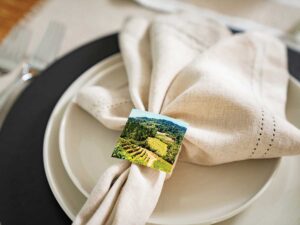 place setting on table with linen napkin on plates with photo napkin ring for the Karen Crouse Napa Valley article